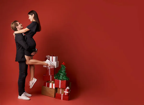 Couple in love with Christmas gifts — Stock Photo, Image