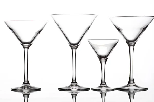 Glasses of different shapes on a white background — Stock Photo, Image