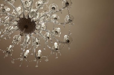  crystal chandeliers with lots of lights in a restaurant