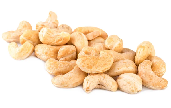 Cashew nuts heap handful on white — Stock fotografie