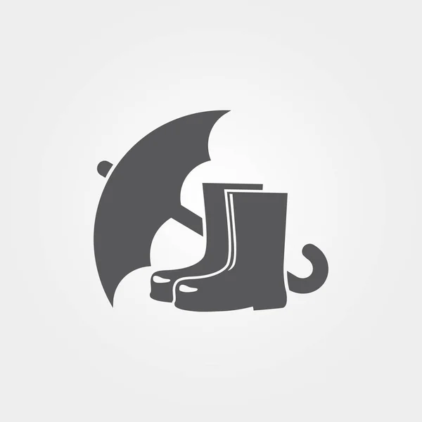 Paraguas con icono de botas de goma — Vector de stock