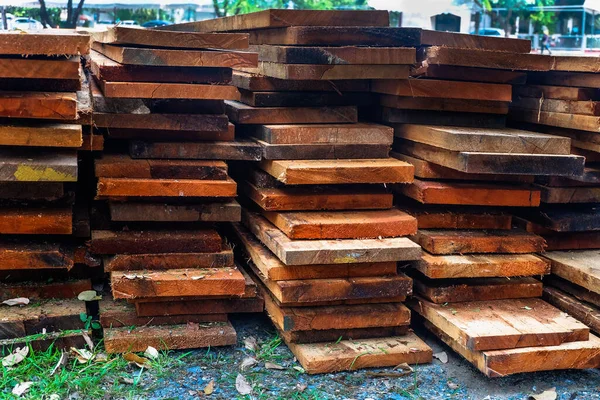 stack of wooden studs in lumberyard. wood timber construction