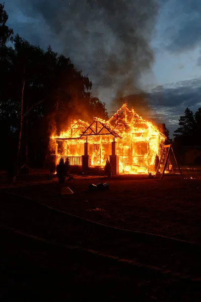 Burning house in the forest