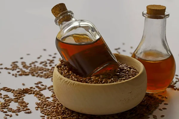 Sesame seeds in bowls and sesame oil in bottles.