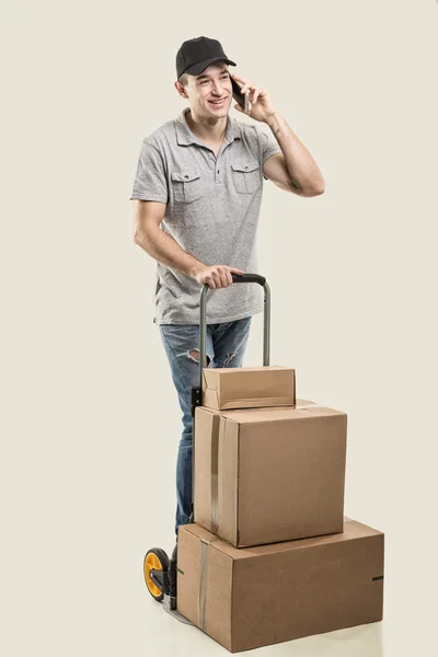 courier with phone delivers parcels