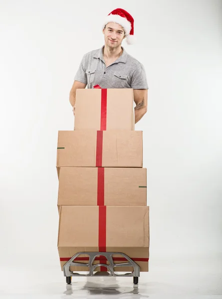Courier standing with packages and gifts — Φωτογραφία Αρχείου
