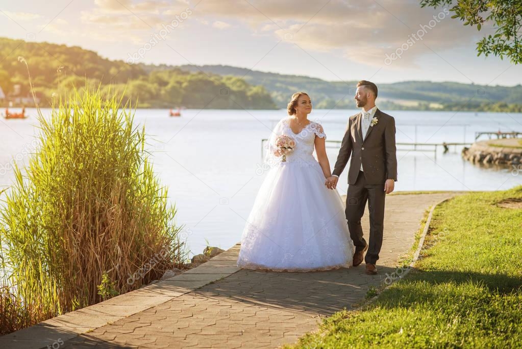 couple near lake on nature