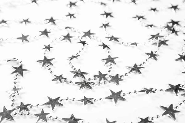 Christmas background with silver stars decorations on white. Simple Christmas composition with copy space — Stock Photo, Image