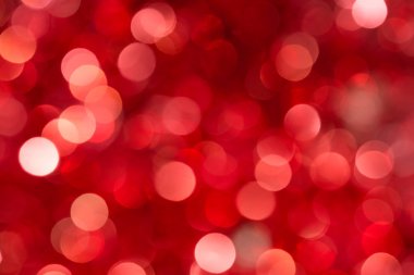Noel ve Yeni Yıl kırmızı bulanıklaştırılmış bokeh arkaplanı