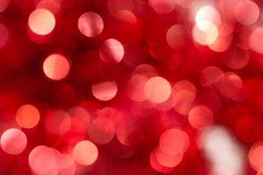 Noel ve Yeni Yıl kırmızı bulanıklaştırılmış bokeh arkaplanı