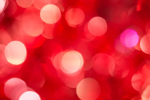 Karácsony és újév piros elmosódott disszidált bokeh háttér — Stock Fotó