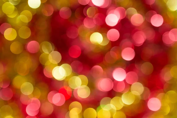 Kerstmis en Nieuwjaar heldere, kleurrijke wazig intreepupil bokeh-achtergrond — Stockfoto