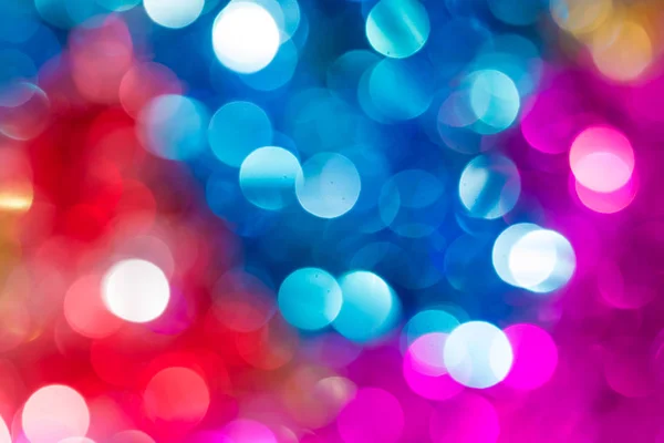 Karácsonyi és újévi világos, színes homályos defocused bokeh háttér — Stock Fotó