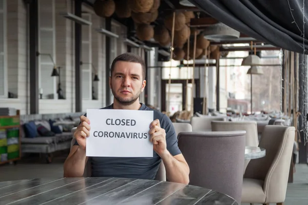 Restaurant director is holding white sheet of paper with word — Stock Photo, Image