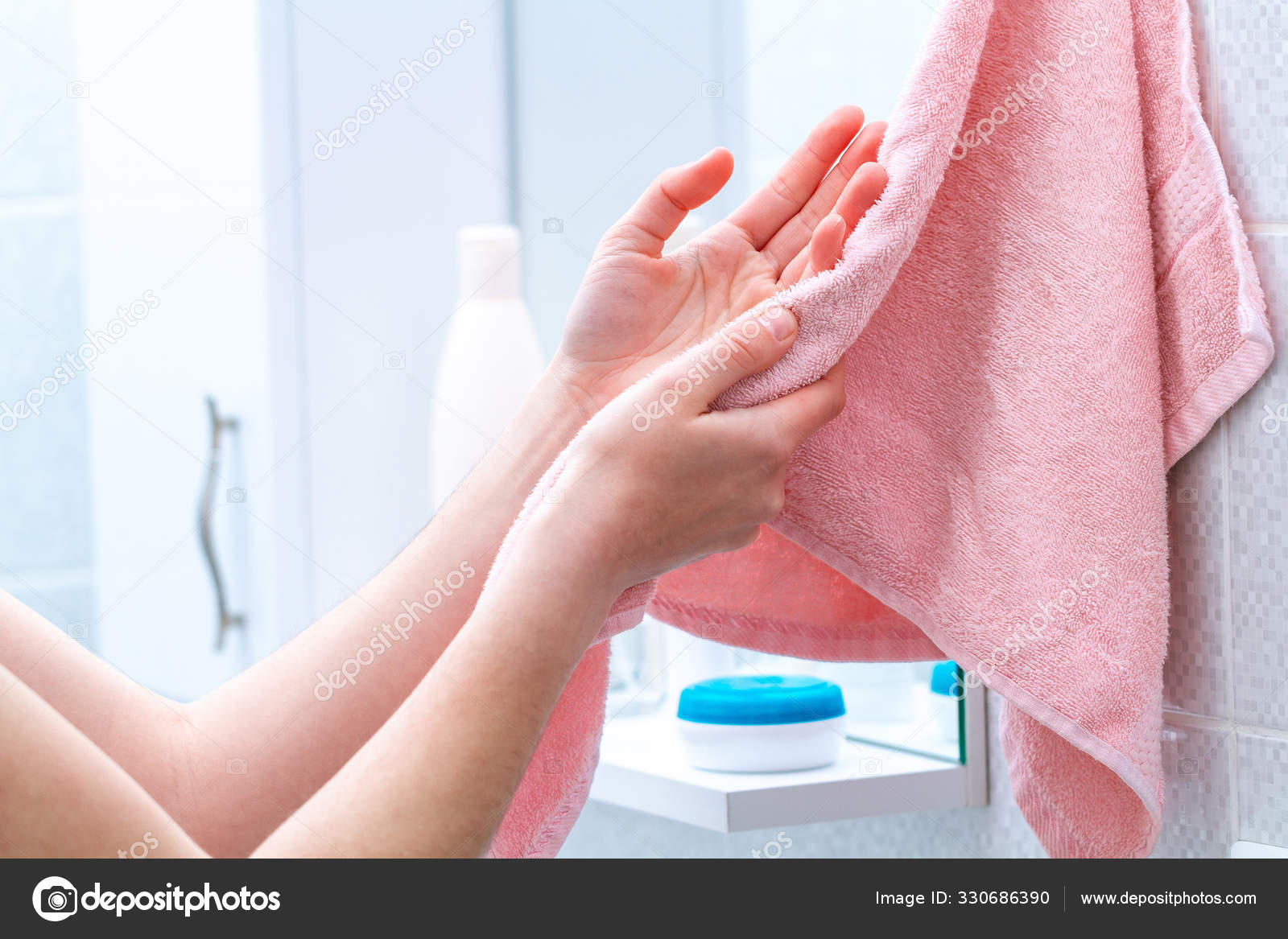 Person Using Towel Wiping Hands Dry Washing Bathroom Home Hygiene Stock Photo goffkein 330686390