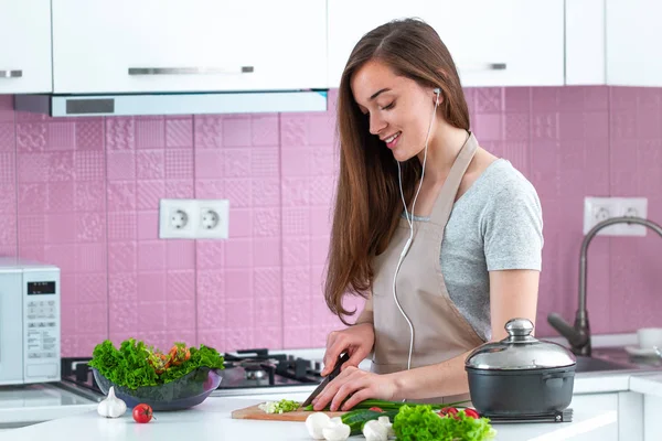 Young Housewife Headphones Apron Listening Music Enjoying Cooking Preparation Kitchen — 스톡 사진