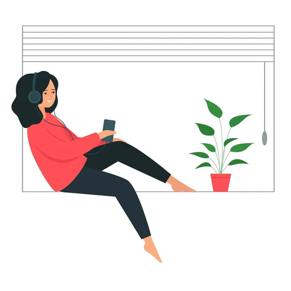La chica de los auriculares se sienta en el alféizar de la ventana. Una joven sostiene un smartphone en su mano y escucha música . — Vector de stock