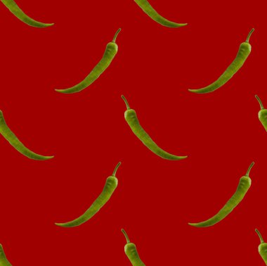 Kırmızı arka planda yeşil biberler tekrarlanıyor