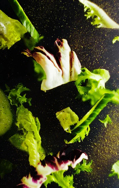 Salad levitate in air. Fresh healthy food. Vertical orientation.