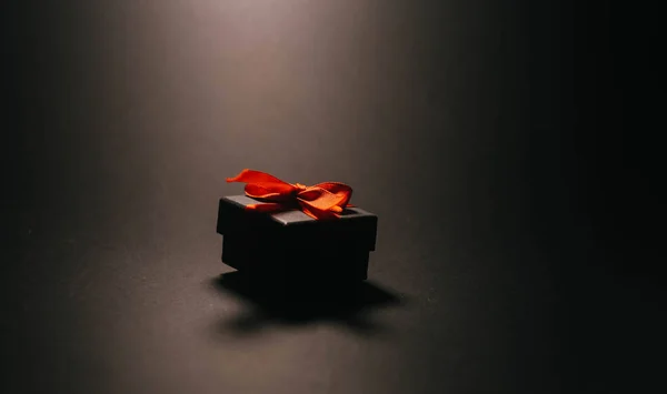 Black box with bow. Black Friday concept. Box silhouette