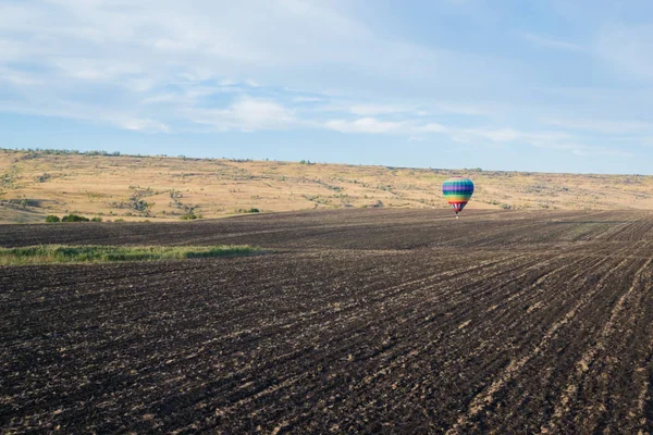 a balloon flying above the ground