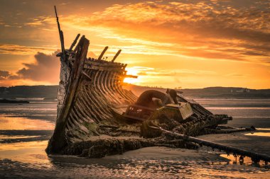 Old Ship Wreck at Sunset clipart
