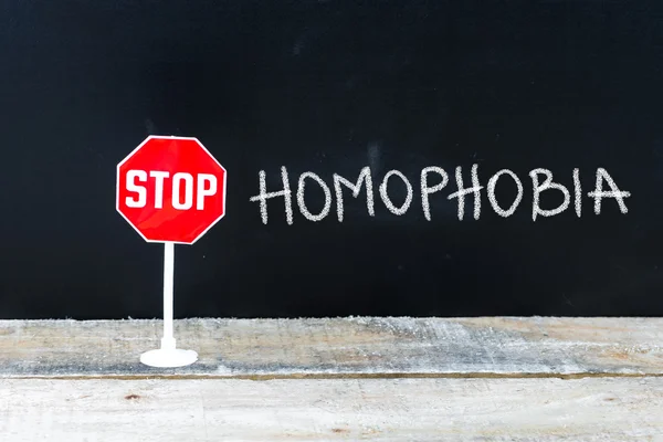 STOP HOMOPHOBIA message written on chalkboard — Stock Photo, Image