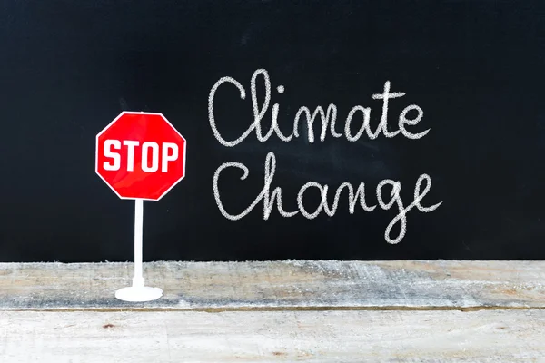 STOP CLIMATE CHANGE message written on chalkboard — Stock Photo, Image