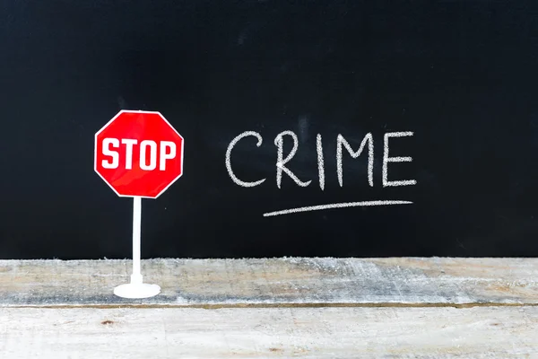 STOP CRIME mensagem escrita no quadro — Fotografia de Stock