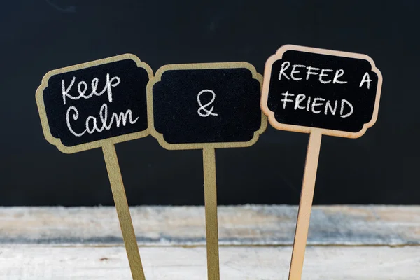 Keep Calm and Refer A Friend message written with chalk on mini blackboard labels — Stock Photo, Image