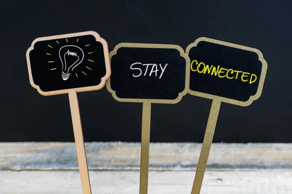 Concept message STAY CONNECTED and light bulb as symbol for idea — Stock Photo, Image