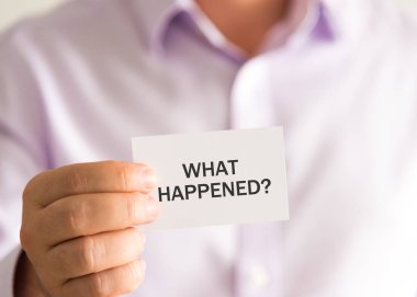 Businessman holding a card with text WHAT HAPPENED ? clipart