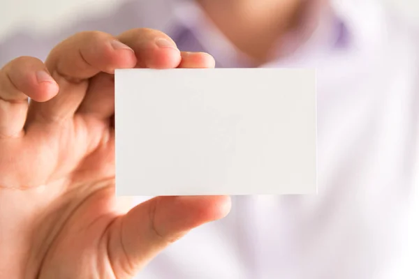 Businessman holding empty message card with copy space for text