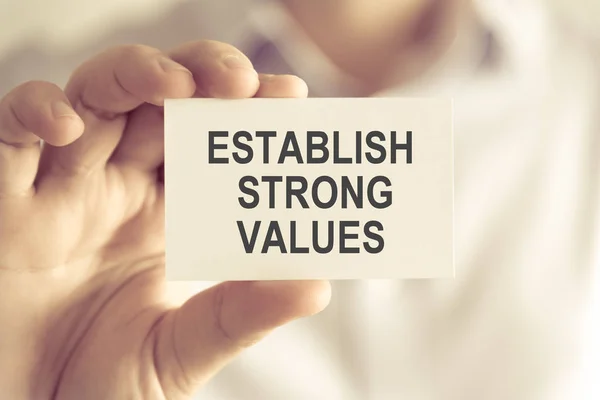 Businessman holding ESTABLISH STRONG VALUES message card — Stock Photo, Image