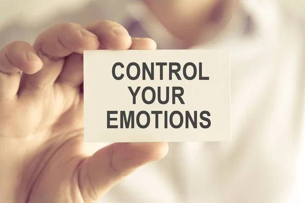 Businessman holding CONTROL YOUR EMOTIONS message card — Stock Photo, Image