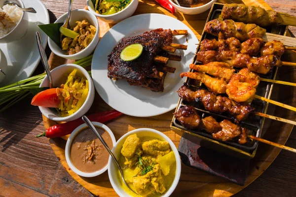 Traditional balinese sea food with satay and curry in Bali, Indonesia — Stock Photo, Image