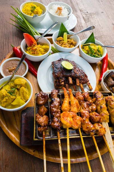 Traditional balinese sea food with satay and curry in Bali, Indonesia — Stock Photo, Image