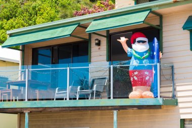 Inflatable Santa Claus at house balcony, Gold Coast Australia clipart
