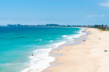 Currumbin, Queensland, Australia-December 23, 2017 : Coastal sand beach at Currumbin, a major tourist destination with subtropical climate. clipart