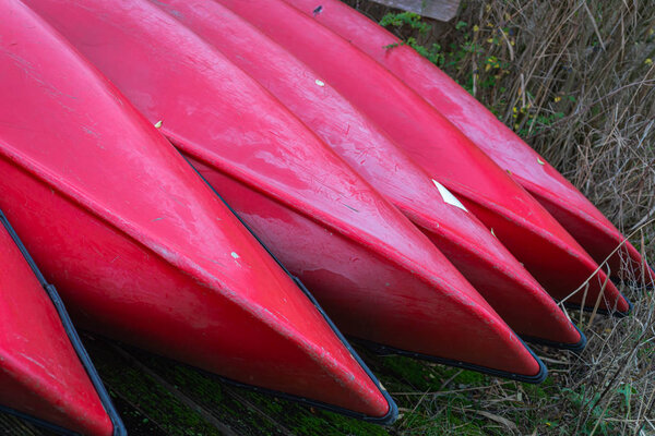 Group of canoes and rental kayak on the canal shore in Zoeterwou