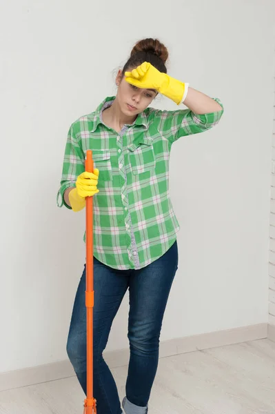 Girl with a mop washes Cleaning apartment — Stock Photo, Image