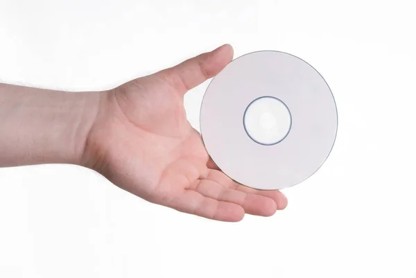 Лазерный диск в мужской руке — стоковое фото