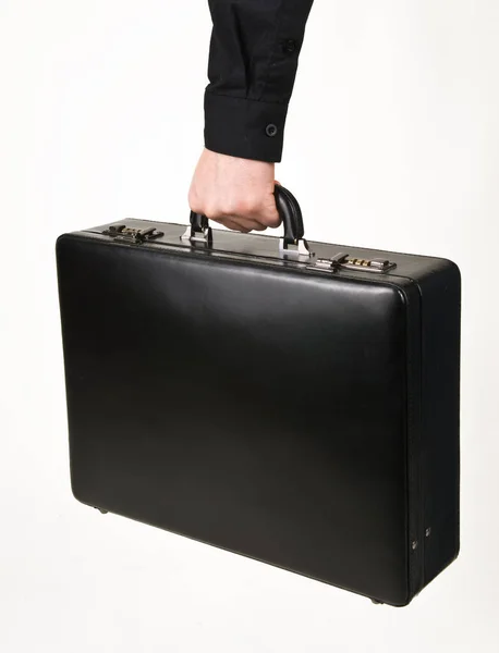 Czarna walizka biurowa na dokumenty w dłoni na białym tle — Zdjęcie stockowe