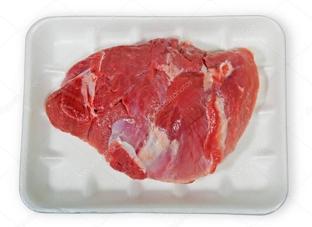 Raw meat in packaging isolated on a white background.