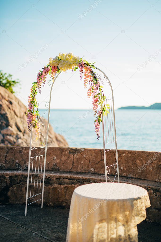 Forged wedding arch. Wedding on the sea at sunset, Montenegro, P
