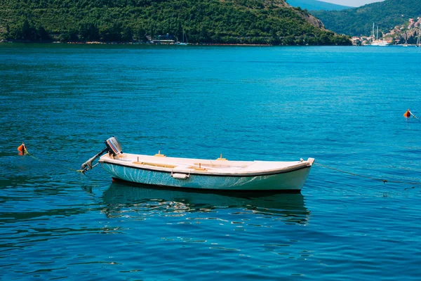 Wooden boats on the water. In the Bay of Kotor in Montenegro. Ma