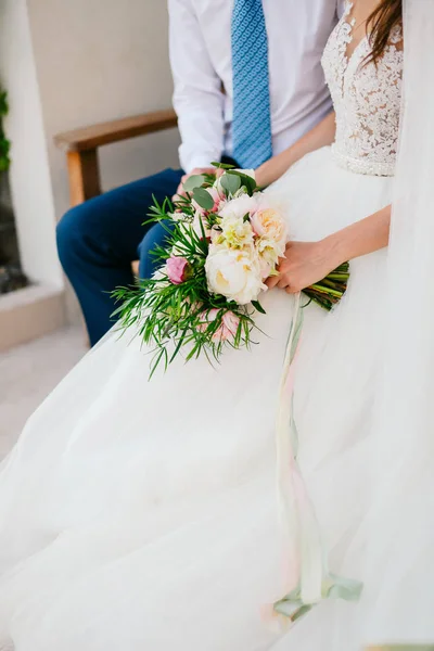 Wedding bouquet of peonies in the hands of the bride. Wedding in — Stock Photo, Image