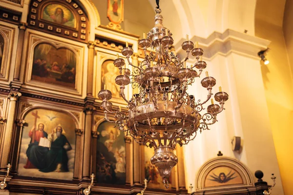The interior of the church. Icons, chandelier, candles in a small church — Stock Photo, Image