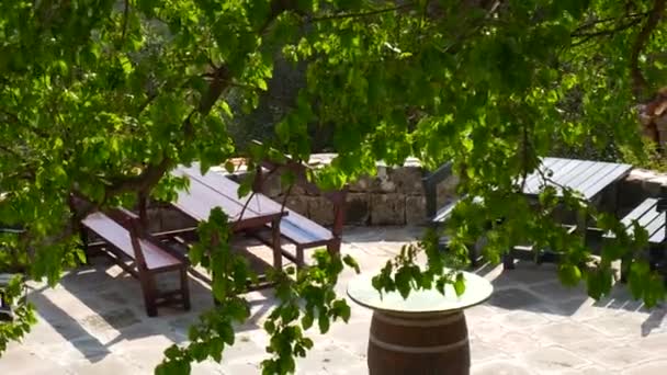 Wooden tables and chairs on summer area in the cafe — Stock Footage Wooden tables and chairs on summer area in the cafe Video Clip