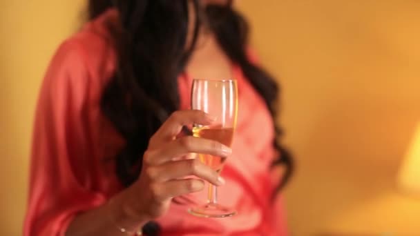 Glass of champagne in woman hands — Stock Video